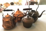 Group of 4 copper kettles