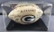 Autographed Green Bay Packers Super Bowl champions football in display case