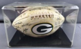 Autographed Green Bay Packers Super Bowl champions football in display case