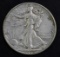 1938 D Walking Liberty Silver Half Dollar.