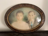 Antique Oval Portrait of a Couple in a Convex Frame