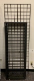 Group of 5 black grid wall panels and base.