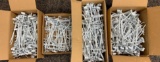 Four boxes of 8 inch white grid wall hooks
