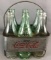 7 piece group vintage glass Coca-Cola/Capitol City bottles in metal 6-pack carrier