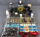 Large group of assorted beads, buttons, and more