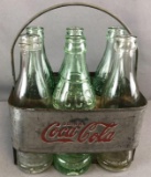 7 piece group vintage glass Coca-Cola/Capitol City bottles in metal 6-pack carrier