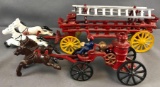 Group of 2 Cast iron toy horse drawn fire trucks