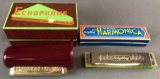 Group of 2 vintage harmonicas in original packaging