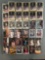 Group of 30+ plastic card cases holding assorted NBA trading cards and more