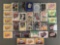 Group of 30+ plastic card cases holding assorted sports trading cards