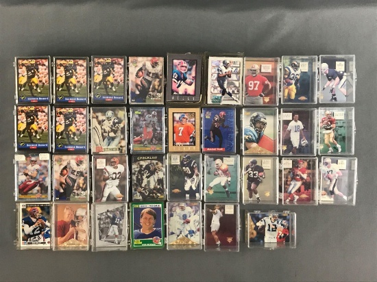 Group of 30+ plastic card cases containing NFL trading cards