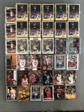 Group of 30+ plastic card cases holding assorted NBA trading cards and more