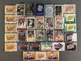 Group of 30+ plastic card cases holding assorted sports trading cards