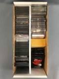 Box of assorted sports trading cards, sleeves, cases