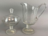 Group of two early American pressed glass three face pattern items