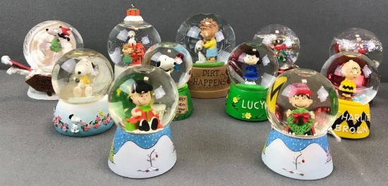 Group of 11 assorted Peanuts miniature water globes