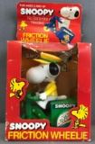Vintage Peanuts Snoopy Friction Wheelie vehicle in original packaging