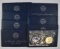 Group of (8) Eisenhower 40% Silver BU Dollars in Blue Envelopes