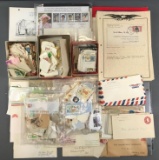 Large group of assorted postage stamps, envelopes, and more