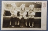 Antique photograph of triplet little girls