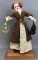 Vintage 12 inch bisque doll on stand