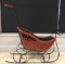 Antique wicker and iron doll sleigh
