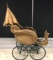 Antique wicker buggy with parasol