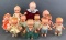 Group of 11 assorted Kewpie style dolls, powder shakers