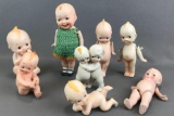 Group of 8 assorted Kewpie style porcelain figurines and dolls