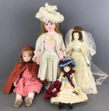 4 piece group of assorted soft body dolls