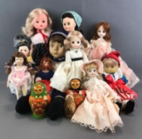 13 piece group of assorted dolls