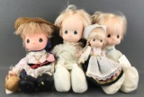 Group of 4 Precious Moments dolls