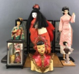 7 piece group of assorted Asian dolls and decor