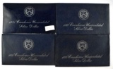 Group of (4) Eisenhower 40% Silver BU Dollars in Blue Envelopes 1971-1974