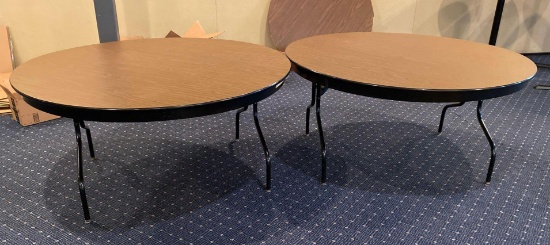 Group of two 60 inch round heavy duty banquet hall tables