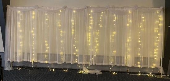 Beautiful banquet hall backdrop with lights on stands