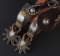 Fancy pair of Ronnie Jones double mounted Spurs, # 963, with steer head motif, heart shaped shanks w