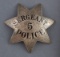 Ornate silver 7-point star Badge, 