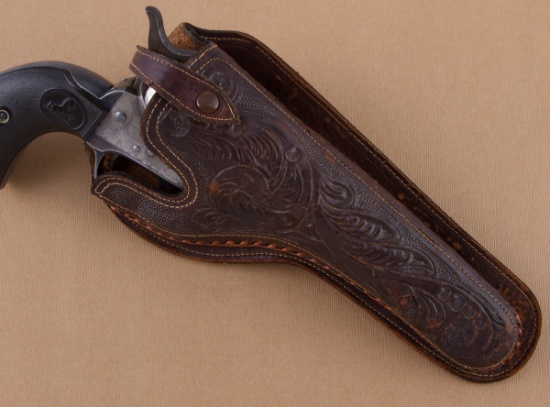 Vintage floral carved Holster with leather wrapped border.  Will fit a 4 3/4" Colt single action.  C