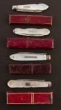 Rare group of four early Pen Knives with carved mother of pearl handles and their original two piece