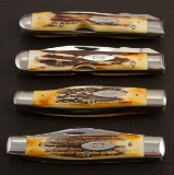 Collection of four unused Colt XX folding Knives, two have 3 blades and two are single locking blade