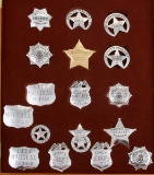 Framed Collection of 18 sterling silver marked Display Badges, no pins, representing Lawmen of the e