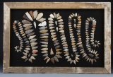 A framed collection of 207 Arrowheads in the Rattle Snake pattern, framed in wooden water stock barr