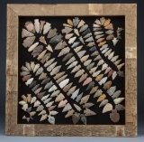 A framed collection of 130 Arrowheads in the Rattle Snake pattern, framed in wooden water stock barr