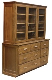 Vintage 2 piece oak Wall Cabinet.  Upper section has three doors, lower section has nine drawers.  C