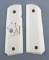 Pair of faux Ivory Grips for a Model 1911, right grip has raised card suits, excellent condition.