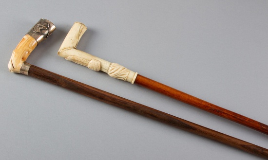 Two antique Canes, one has polished bone handle with silver cap, measuring 33", the other is 36" lon