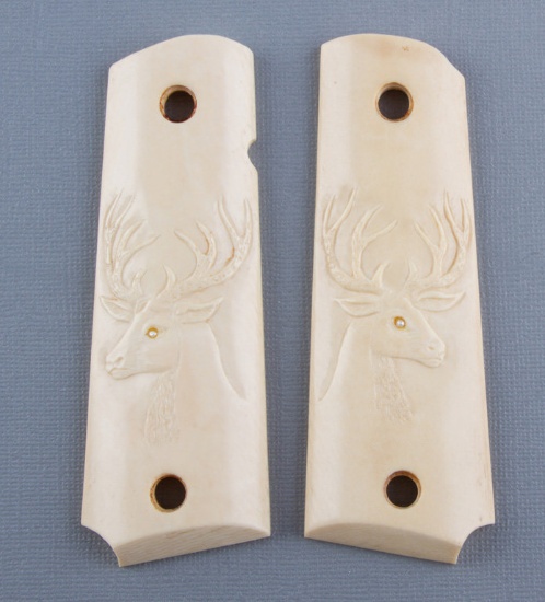 Pair of Ivory Grips for a Model 1911,  both right and left grips have carved deer heads, excellent c