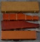 Group of four leather Carry Cases for take down models, both shotguns / rifles, both large square ca