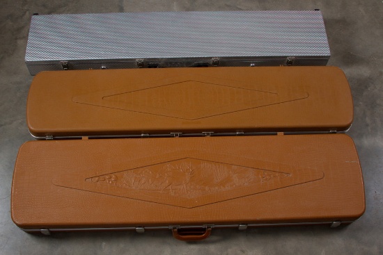 Group of three padded shotgun / rifle Carry Cases, one aluminum case is marked Alpine, the other two